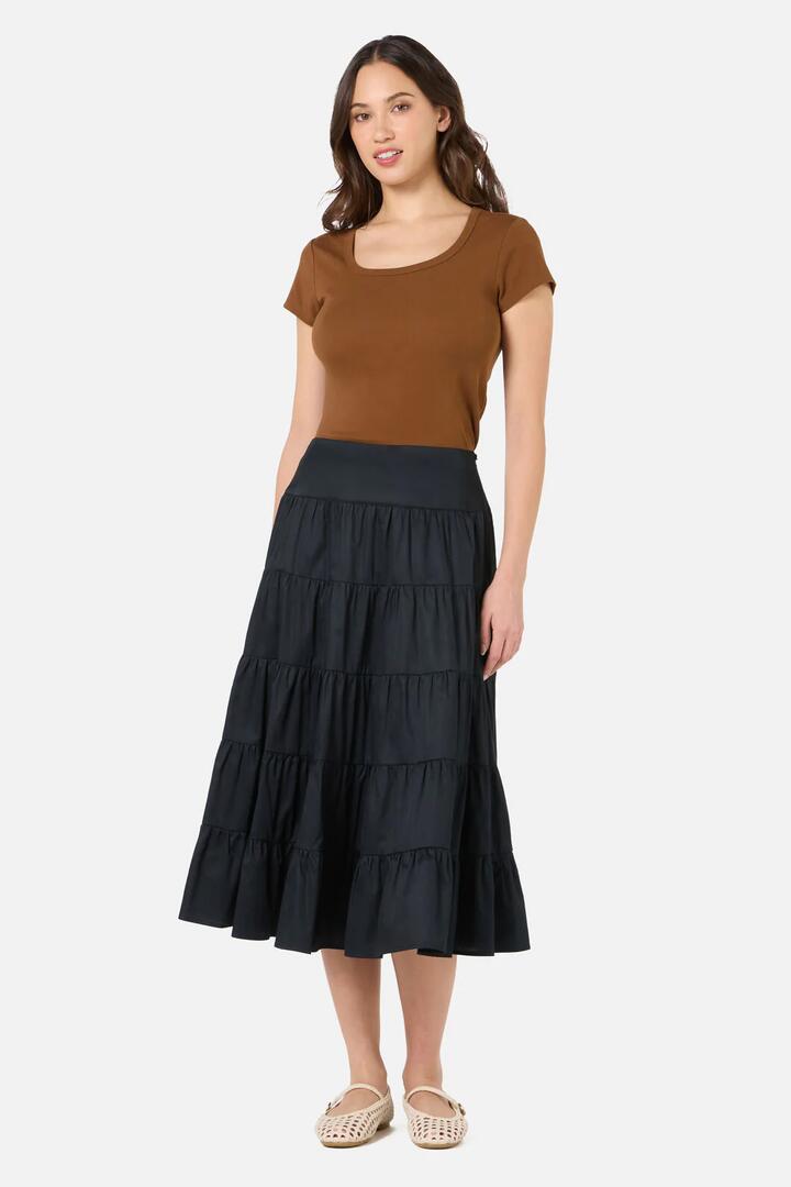 Image of a model wearing Skirts. Product name - Gillie Midi Skirt in Rust colour by brand - Princess Highway