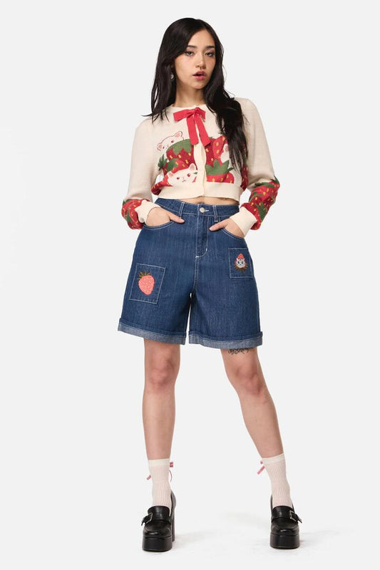 Image of a model wearing Shorts. Product name - Strawberry Cat Embroidered Short in Blue Denim colour by brand - Dangerfield