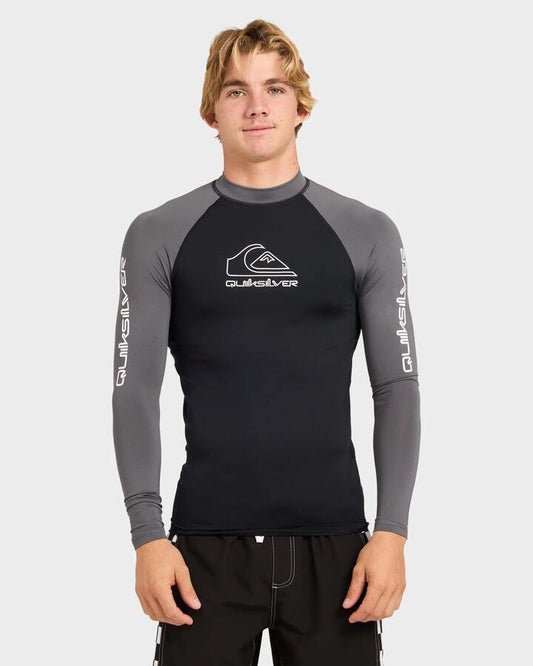 Image of a model wearing Tops. Product name - Quiksilver Mens On Tour Upf 50 Long Sleeve Rashguards Iron Gate in Iron Gate colour by brand - Quiksilver