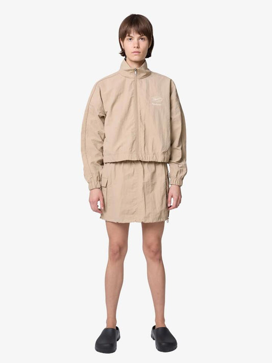 Image of a model wearing Skirts. Productname: Reebok Women's Parachute Skirt in Neutral colour by brand - Reebok