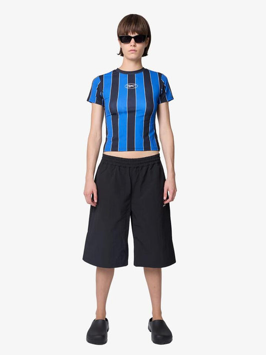 Image of a model wearing Tops. Productname: Reebok Women's Cycling Top in Blue/Black colour by brand - Reebok