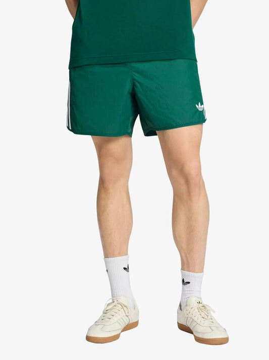 Image of a model wearing Shorts. Productname: Adidas Sprinter Shorts in Collegiate Green colour by brand - Adidas