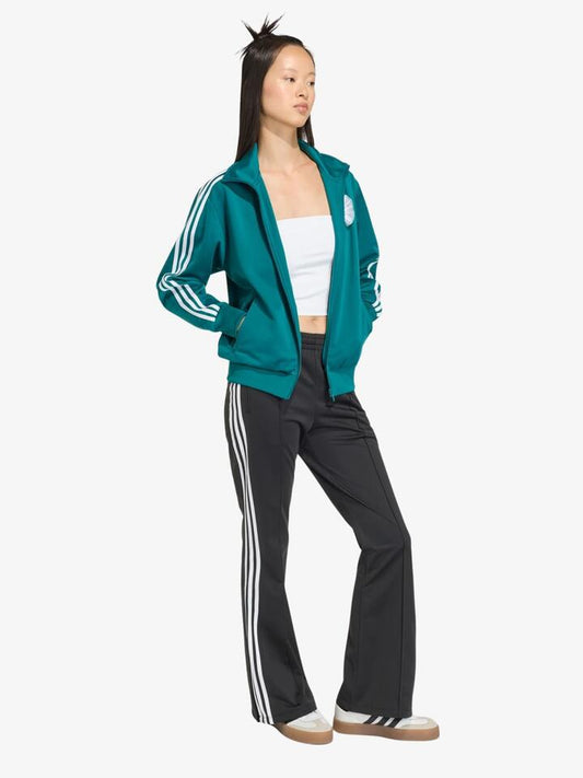 Image of a model wearing Pants. Productname: Adidas Adiluna Bell Bottom Firebird Pants in Black colour by brand - Adidas