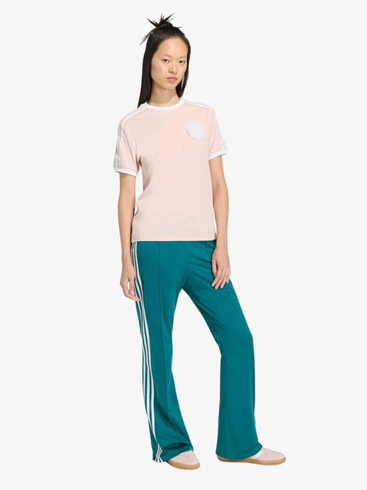Image of a model wearing Pants. Productname: Adidas Adiluna Bell Bottom Firebird Pants in Legacy Teal colour by brand - Adidas