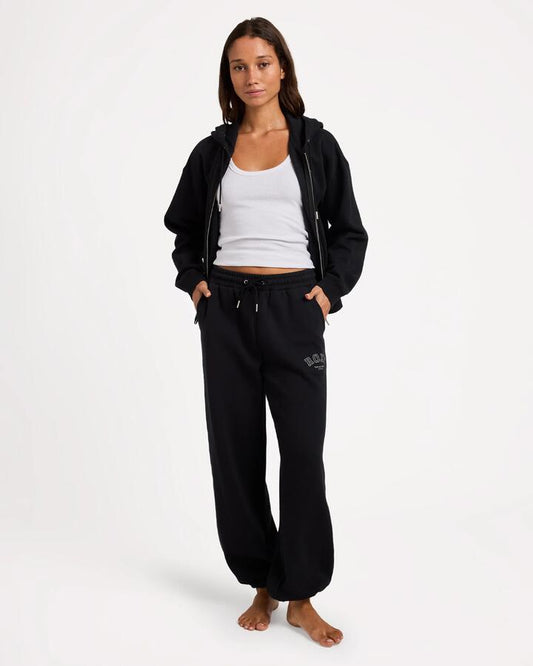 Image of a model wearing Pants. Product name - Roxy Womens Dreamy Days Trackpants Black in Black colour by brand - Roxy