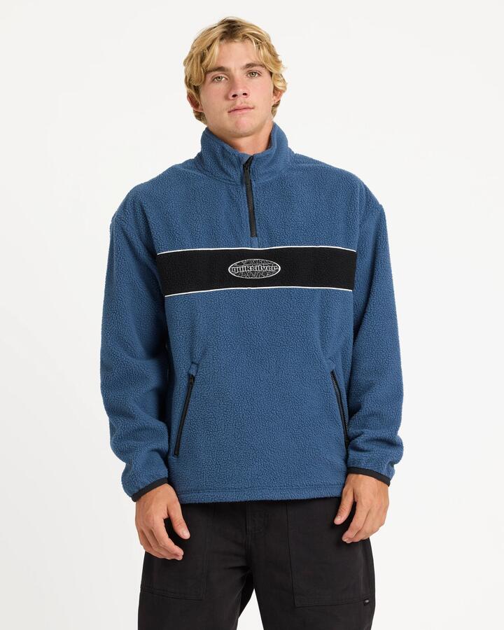 Image of a model wearing Outerwear. Product name - Quiksilver Mens Mercury Panel 1/4 Zip Fleece Jumper Dark Denim in Dark Denim colour by brand - Quiksilver