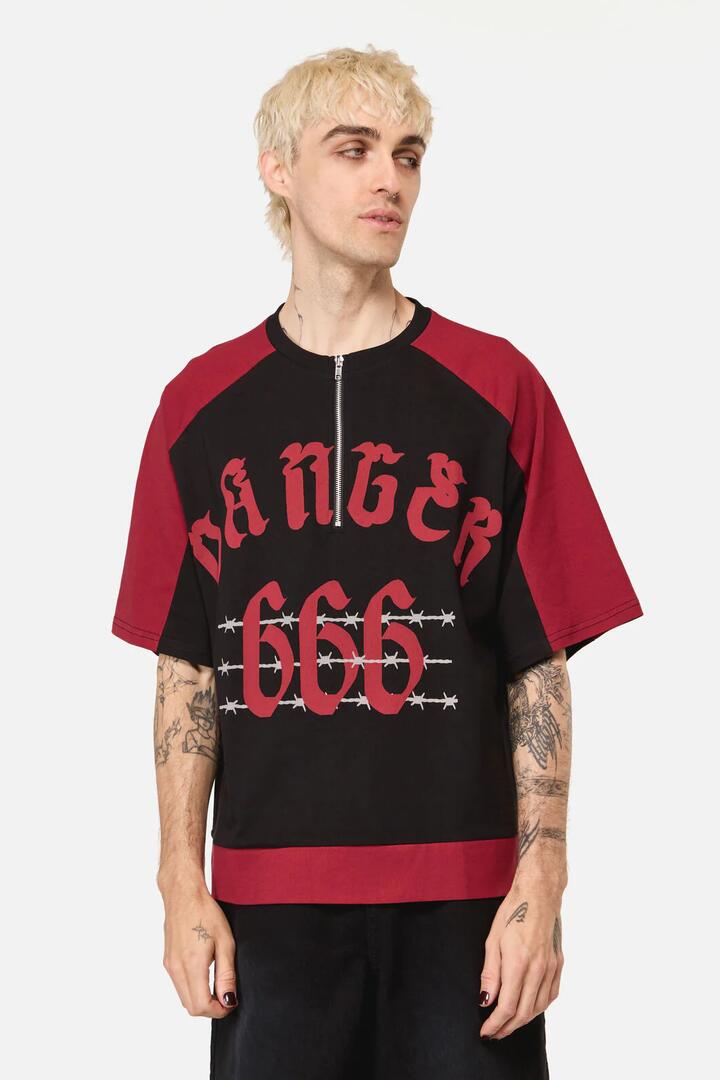 Image of a model wearing Tops. Productname: Danger Sporty Goth Top in Black Red colour by brand - Dangerfield