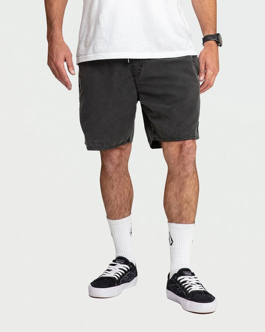 Image of a model wearing Shorts. Productname: volcom Mens Center 17" Swim Shorts Black - in Black colour by brand - Volcom