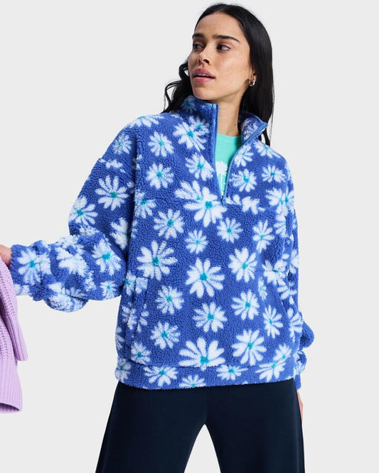 Image of a model wearing Outerwear. Product name - Roxy Womens Jive Talking Binded Half Zip Fleece Jumper Coconut Milk Flower Soul in Coconut Milk Flower Soul colour by brand - Roxy