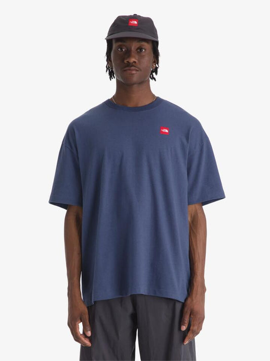 Image of a model wearing Tops. Productname: The North Face Men's Red Box Tee in Lunar Blue colour by brand - The North Face
