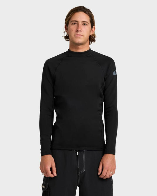 Image of a model wearing Tops. Productname: quiksilver Mens Everyday Heat Long Sleeve Rash Vest Black - in Black colour by brand - Quiksilver