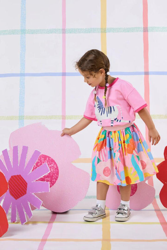 Image of a model wearing Skirts. Product name - Cut Paste Floral Kids Skirt in Pink colour by brand - Gorman