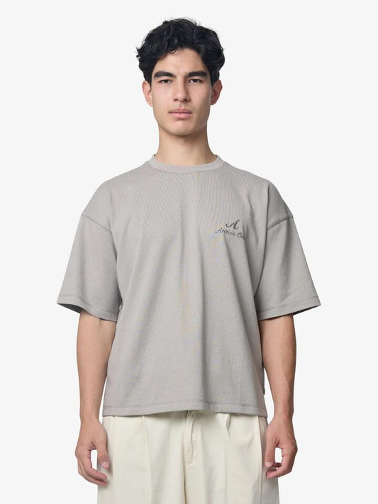 Image of a model wearing Tops. Productname: Article One Needle Point Tee in Ash colour by brand - Article One