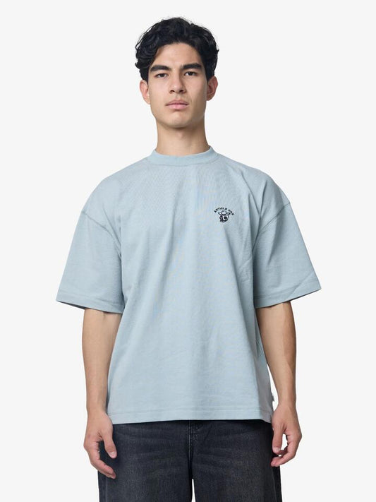 Image of a model wearing Tops. Productname: Article One Black Hole Tee in Mist colour by brand - Article One