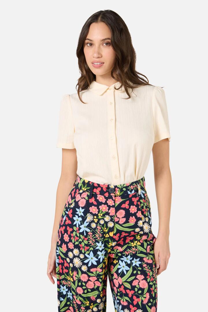 Image of a model wearing Tops. Productname: Lee Short Sleeve Blouse in Cream colour by brand - Princess Highway