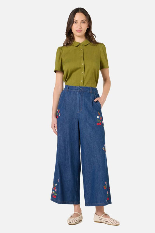 Image of a model wearing Pants. Product name - Berry Bloom Embroidered Culotte in Blue Denim colour by brand - Princess Highway