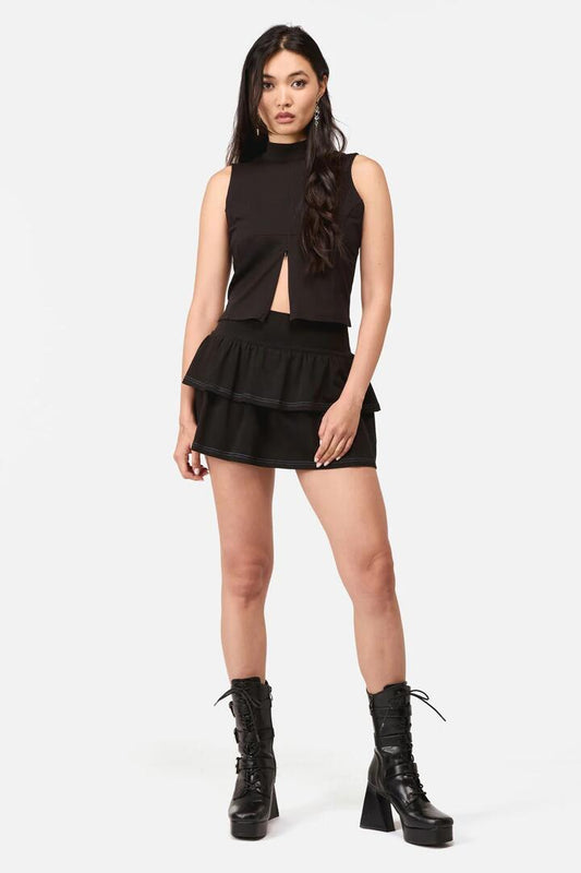 Image of a model wearing Tops. Productname: Whirl Y2K Jersey Frill Skort in Black colour by brand - Dangerfield
