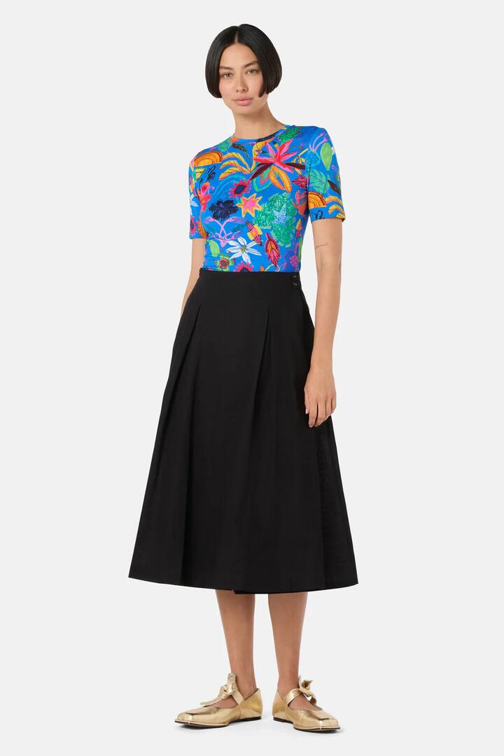 Image of a model wearing Skirts. Product name - Pleated Tomasa Skort in Black colour by brand - Gorman