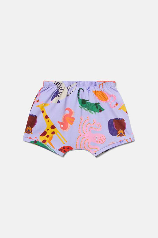 Image of a model wearing Shorts. Product name - Zoo Tropics Baby Shorts in Lilac colour by brand - Gorman