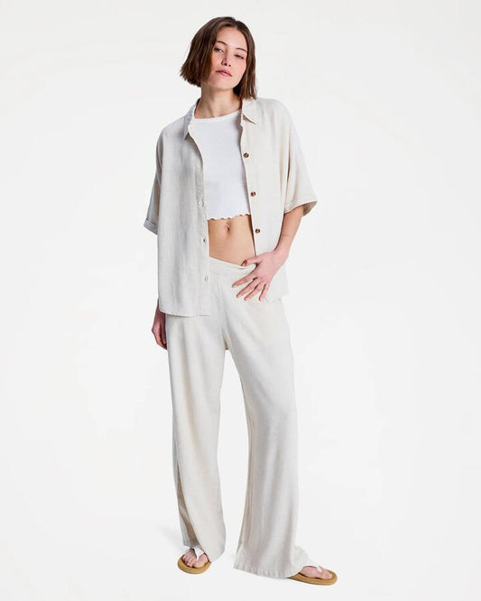 Image of a model wearing Pants. Productname: roxy Womens Midnight Avenue Solid Pants Natural - in Natural colour by brand - Roxy