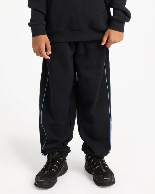 Image of a model wearing Pants. Product name - Quiksilver Boys 8-16 Panelled Track Pants Black in Black colour by brand - Quiksilver