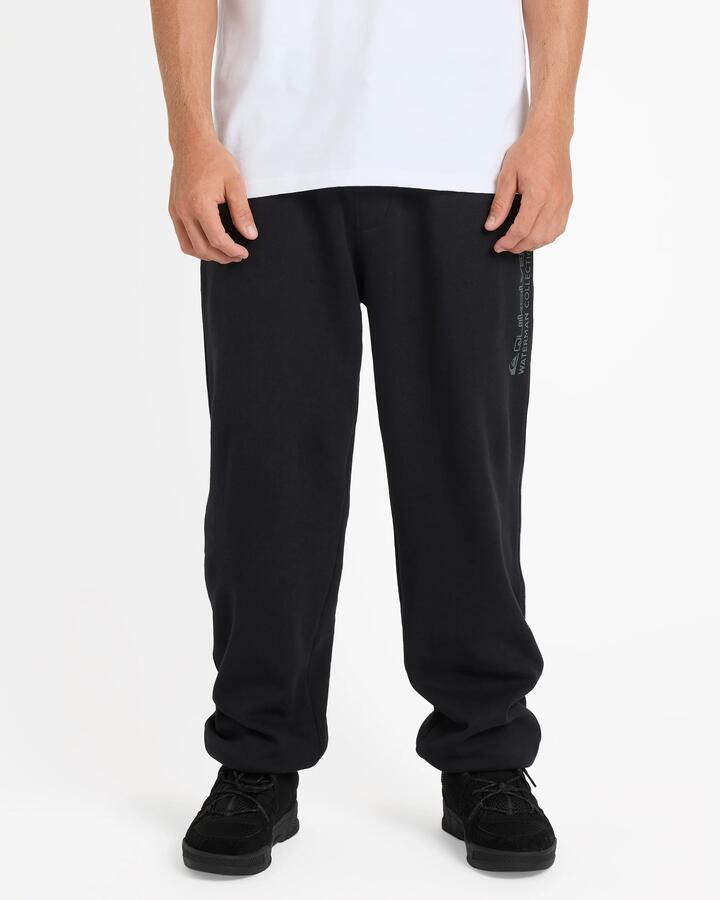 Image of a model wearing Pants. Product name - Quiksilver Mens Watermans Trackpants Black in Black colour by brand - Quiksilver