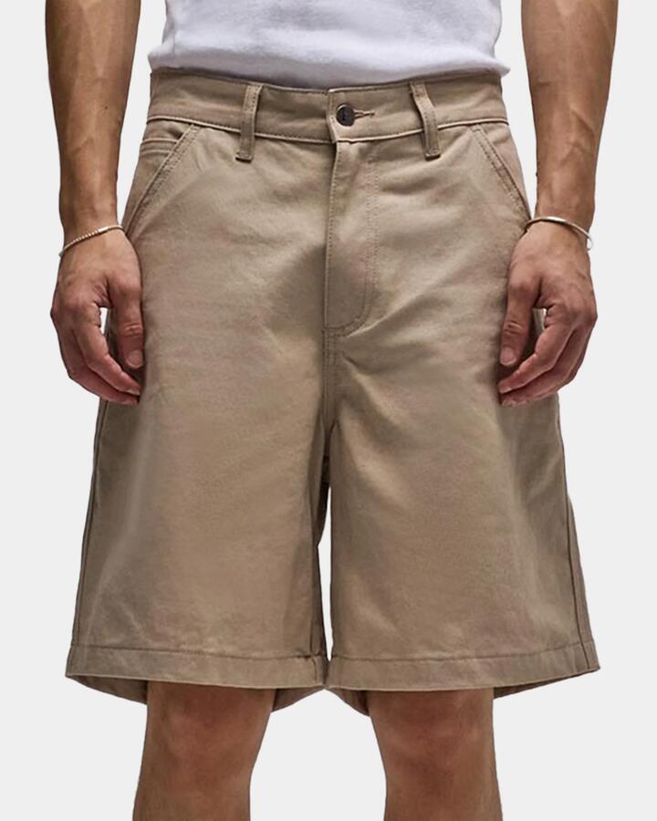 Image of a model wearing Shorts. Product name - Former Mens Reynolds 21" Walkshorts Stone in Stone colour by brand - Former