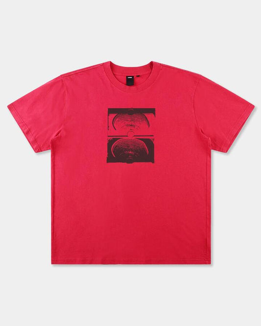 Image of a model wearing Tops. Productname: former Mens Crux Overdye T-Shirt Cherry - in Cherry colour by brand - Former