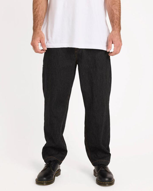 Image of a model wearing Pants. Productname: volcom Mens Work Dialed Carpenter Pants Black Stripe - in Black Stripe colour by brand - Volcom