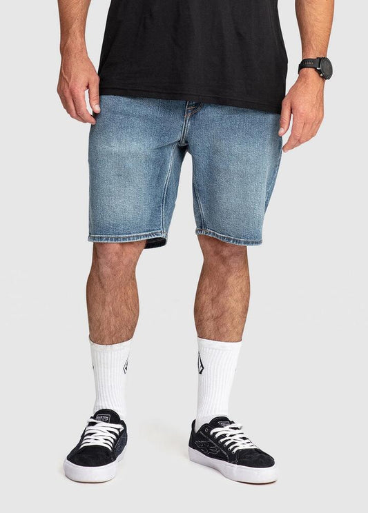 Image of a model wearing Shorts. Productname: Volcom Mens Solver 19" Denim Shorts Old Town Indigo - in Old Town Indigo colour by brand - Volcom