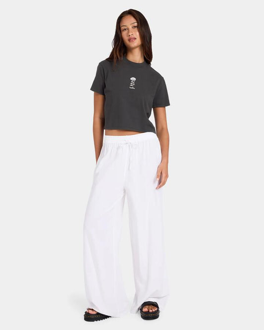 Image of a model wearing Pants. Productname: Volcom Womens Backbeatz Solid Pants White - in White colour by brand - Volcom
