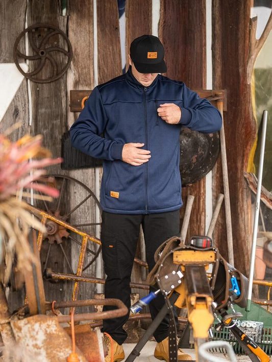 Image of a model wearing Uniforms & Workwear. Productname: Volcom Mens Workwear Bonded Fleece Jacket Navy - in Navy colour by brand - Volcom