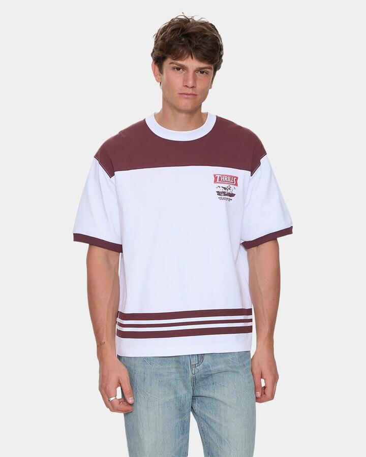 Image of a model wearing Tops. Productname: thrills Mens Deep In The Heart Of Byron T-Shirt Bitter Chocolate - in Bitter Chocolate colour by brand - Thrills