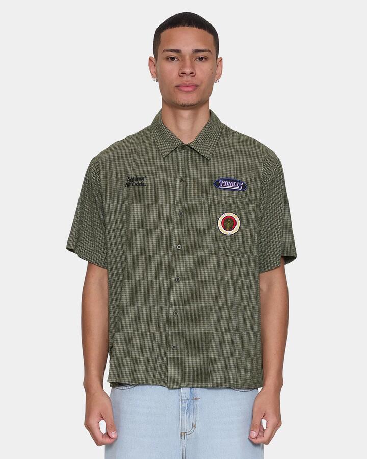 Image of a model wearing Tops. Productname: thrills Mens Against All Odds Cropped Short Sleeve Shirt Oil Green - in Oil Green colour by brand - Thrills