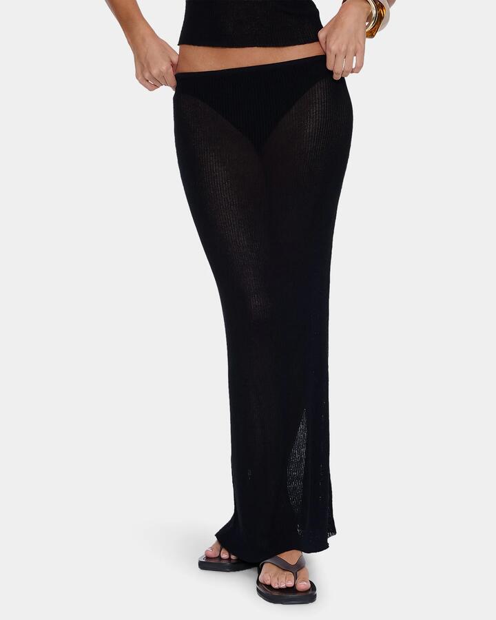 Image of a model wearing Skirts. Product name - Thrills Womens Dissolve My Mind Knit Maxi Skirt Black in Black colour by brand - Thrills