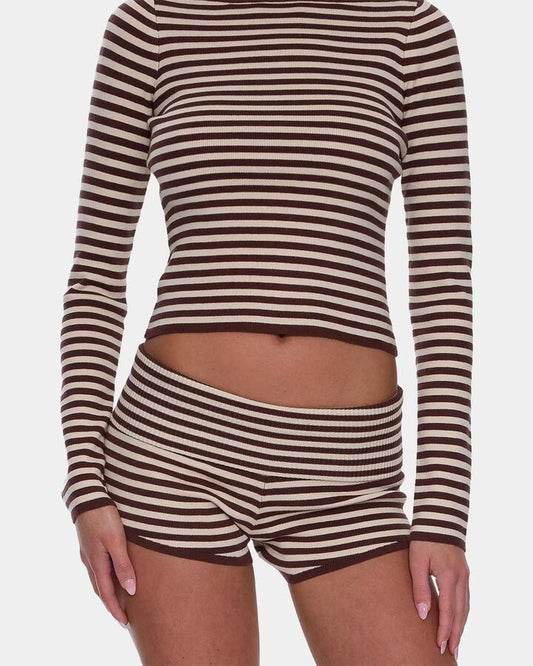 Image of a model wearing Shorts. Productname: thrills Womens Mackenzie Knit Booty Elastic Waist Shorts Butter Cream - in Butter Cream colour by brand - Thrills