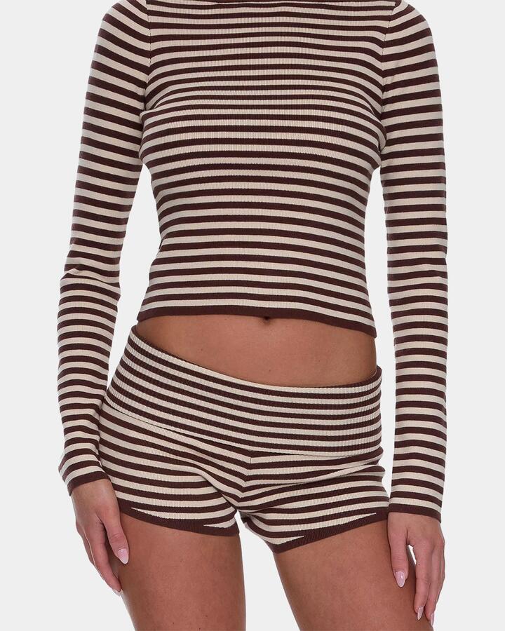 Image of a model wearing Shorts. Productname: Thrills Womens Mackenzie Knit Booty Elastic Waist Shorts Butter Cream - in Butter Cream colour by brand - Thrills