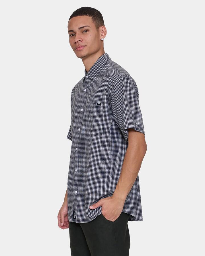 Image of a model wearing Tops. Productname: thrills Mens Locked In Short Sleeve Shirt Black - in Black colour by brand - Thrills