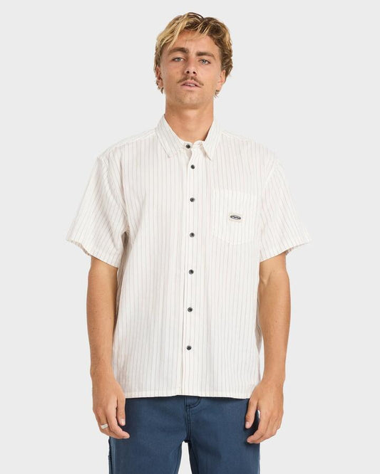 Image of a model wearing Tops. Productname: billabong Mens Bad Dog Short Sleeve Shirt Off White - in Off White colour by brand - Billabong