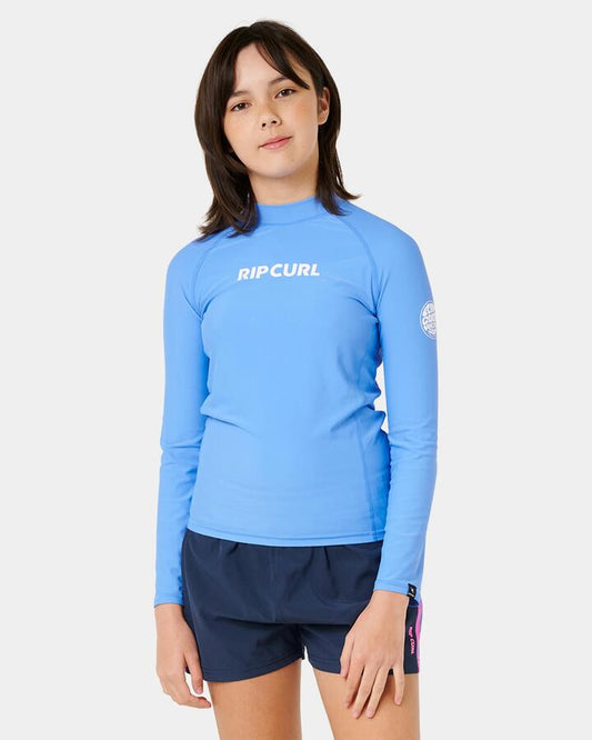 Image of a model wearing Tops. Productname: rip Curl Girls 8-14 Classic Surf Long Sleeve Rash Vest Cornflower Blue - in Cornflower Blue colour by brand - rip Curl