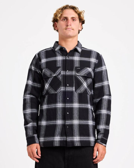 Image of a model wearing Tops. Product name - Volcom Mens Wilderstone Long Sleeve Shirt Black in Black colour by brand - Volcom