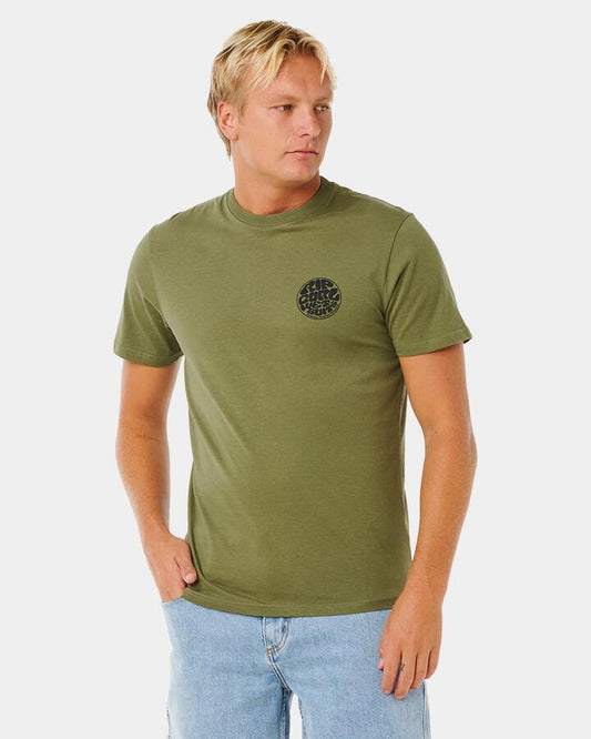 Image of a model wearing Tops. Productname: rip Curl Mens Wettie Icon T-Shirt Surplus Green - in Surplus Green colour by brand - rip Curl