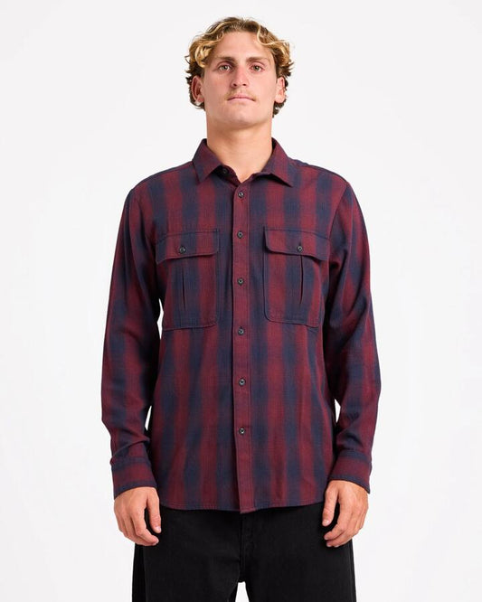 Image of a model wearing Tops. Product name - Volcom Mens Shadowstone Flannel Long Sleeve Shirt Navy in Navy colour by brand - Volcom