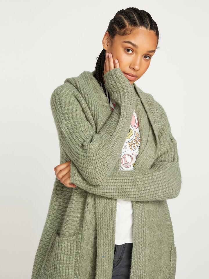 Image of a model wearing Outerwear. Productname: Volcom Womens Homeward Bound Cardigan Light Army - in Light Army colour by brand - Volcom
