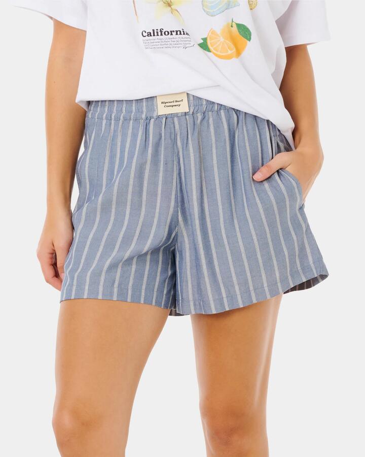Image of a model wearing Shorts. Productname: rip Curl Womens Beach Days Pinstripe Shorts Dusty Blue - in Dusty Blue colour by brand - rip Curl