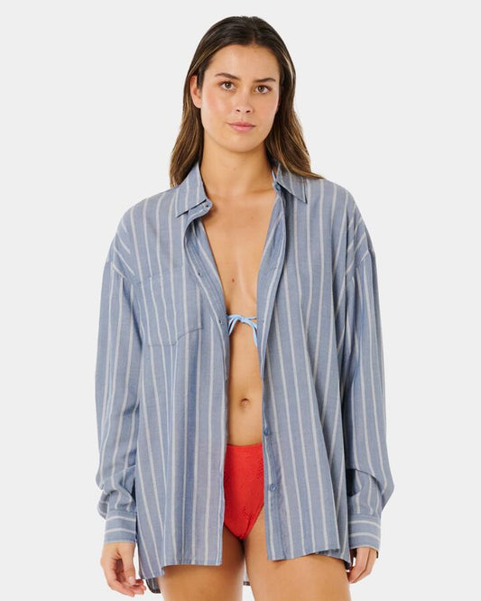 Image of a model wearing Tops. Product name - Rip Curl Womens Beach Days Pinstripe Long Sleeve Shirt Dusty Blue in Dusty Blue colour by brand - Rip Curl