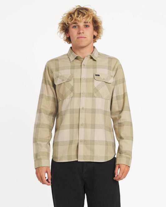 Image of a model wearing Tops. Productname: rvca Mens Thatll Work Flannel Long Sleeve Shirt Light Khaki - in Light Khaki colour by brand - Rvca