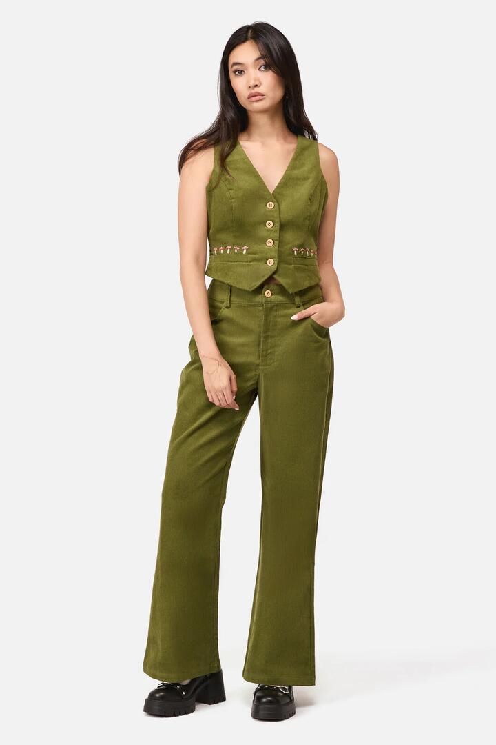 Image of a model wearing Pants. Productname: Toadstool Cord Flare Pant in Green colour by brand - Dangerfield