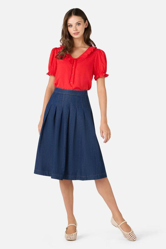 Image of a model wearing Skirts. Productname: Oakley Pleat Midi Skirt in Blue Denim colour by brand - Princess Highway