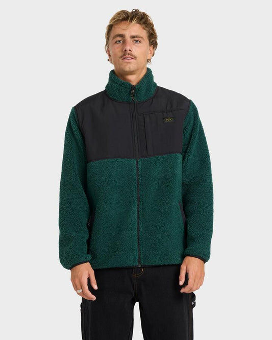 Image of a model wearing Outerwear. Product name - Billabong Mens Boundary Summit Mock Neck Fleece Top Pine Green in Pine Green colour by brand - Billabong